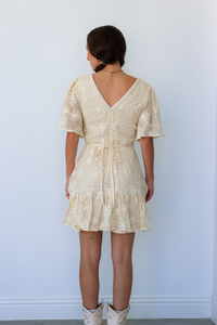 girl wearing cream lace dress