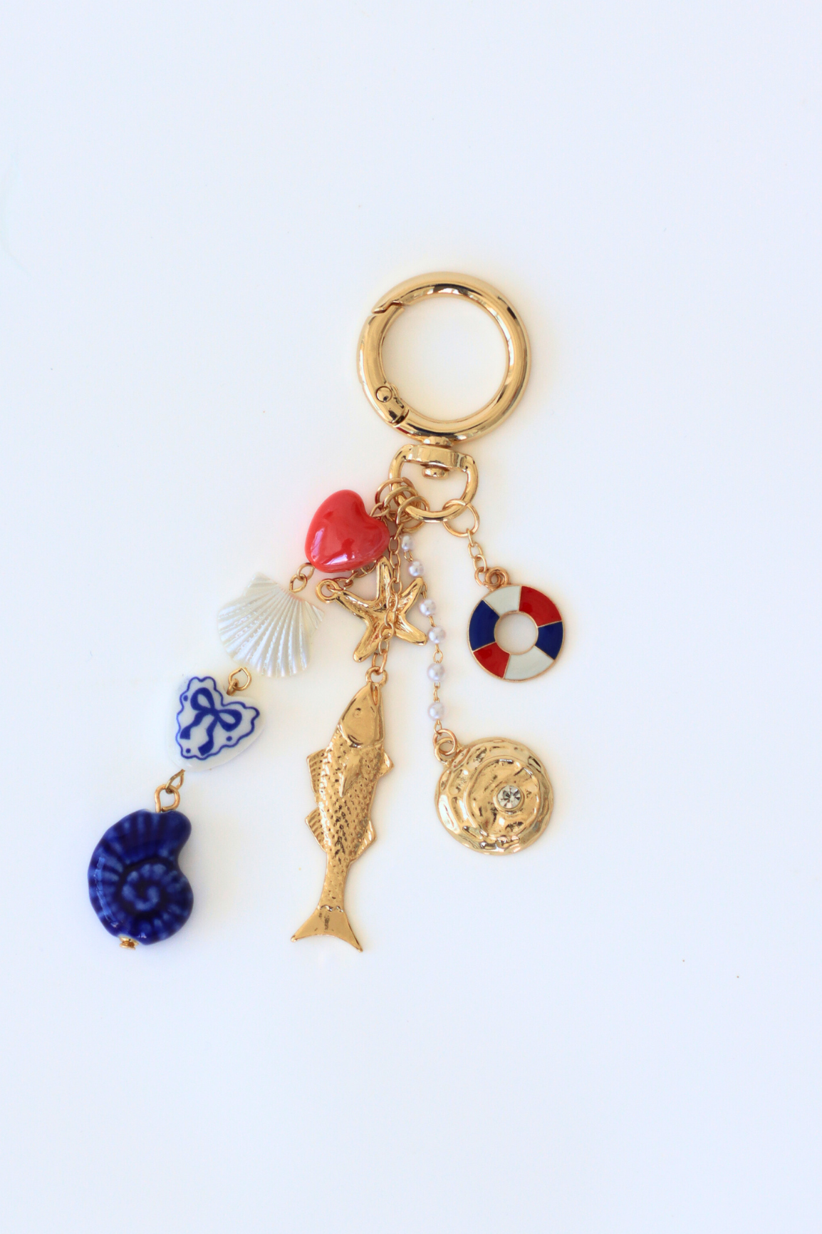 Keychain with various charms on a white background