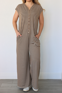 girl wearing brown and cream striped jumpsuit