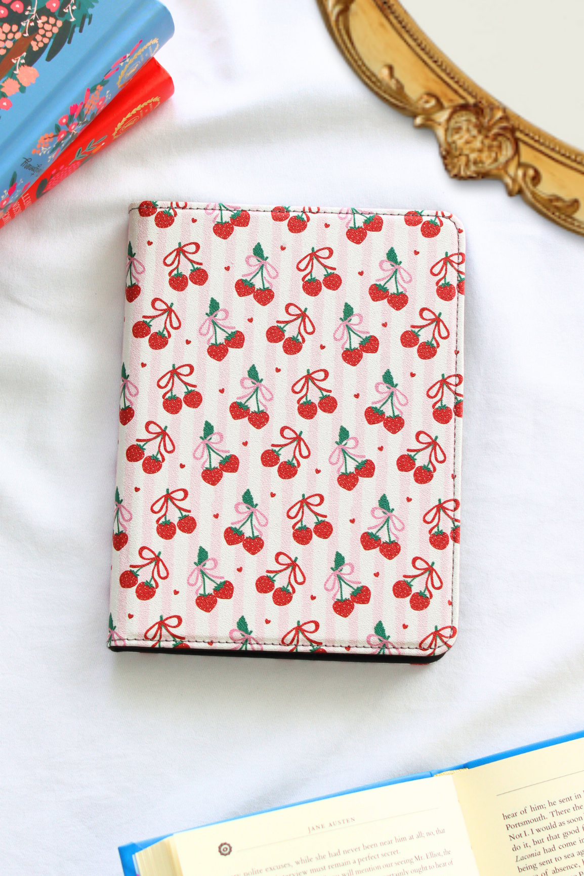 kindle with cherry pattern on a white surface