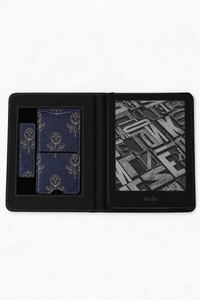 A black faux-leather Kindle e-reader folio case shown open on a white background, featuring a gold floral pattern on the card slots and a visible Kindle screen inside.