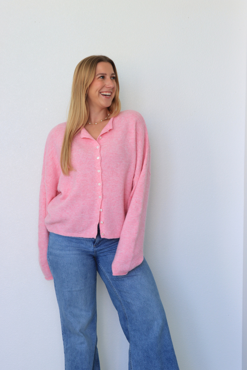girl wearing pink cardigan