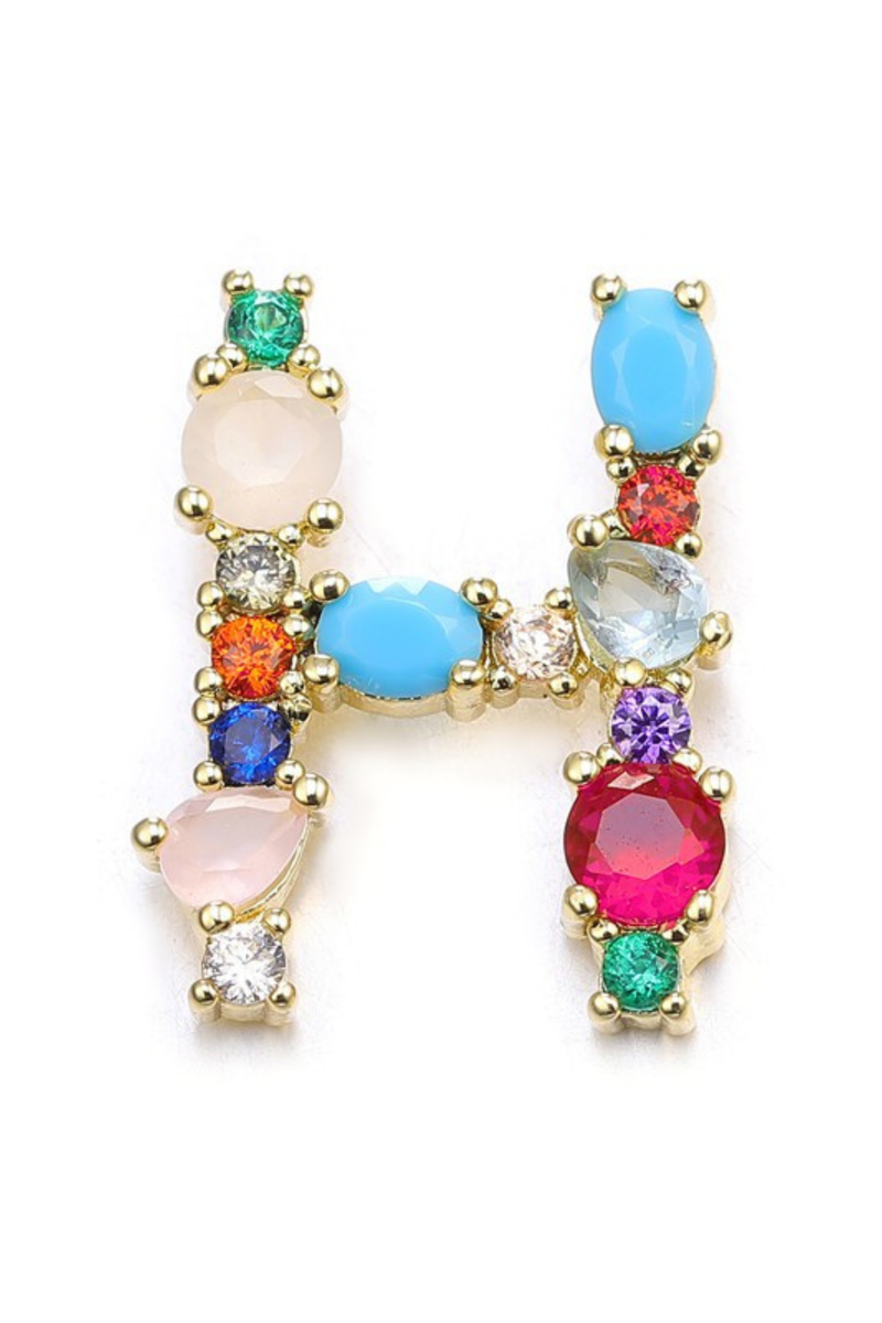 Multicolored gemstone earrings on a white background