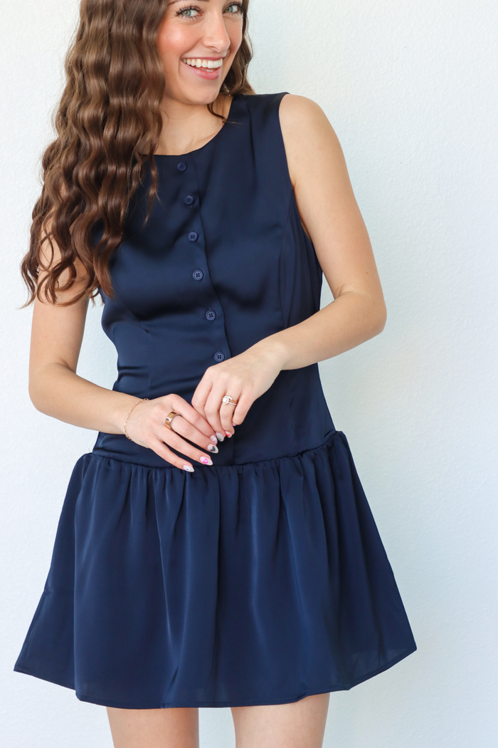 girl wearing navy silk button down dress