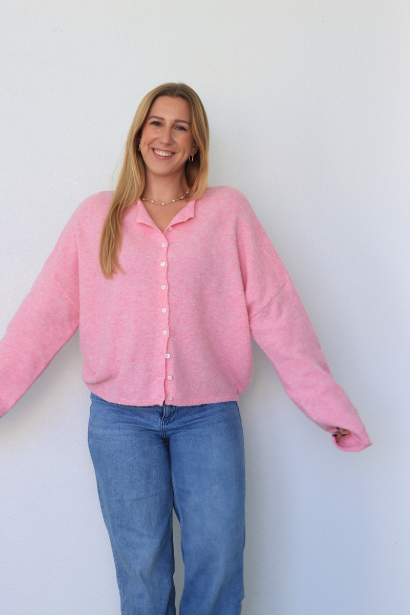 girl wearing pink cardigan