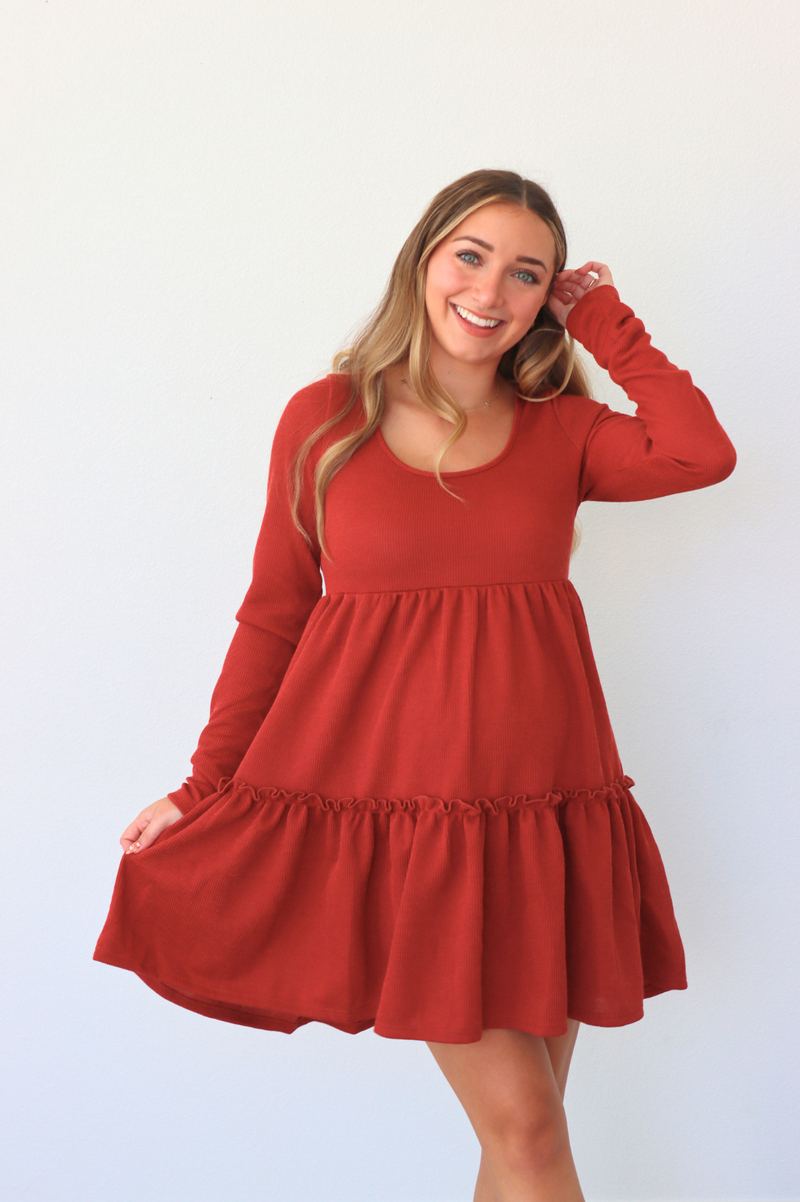 girl wearing red short dress with long sleeves