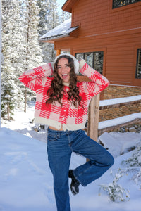 Woman wearing a red and white checkered sweater