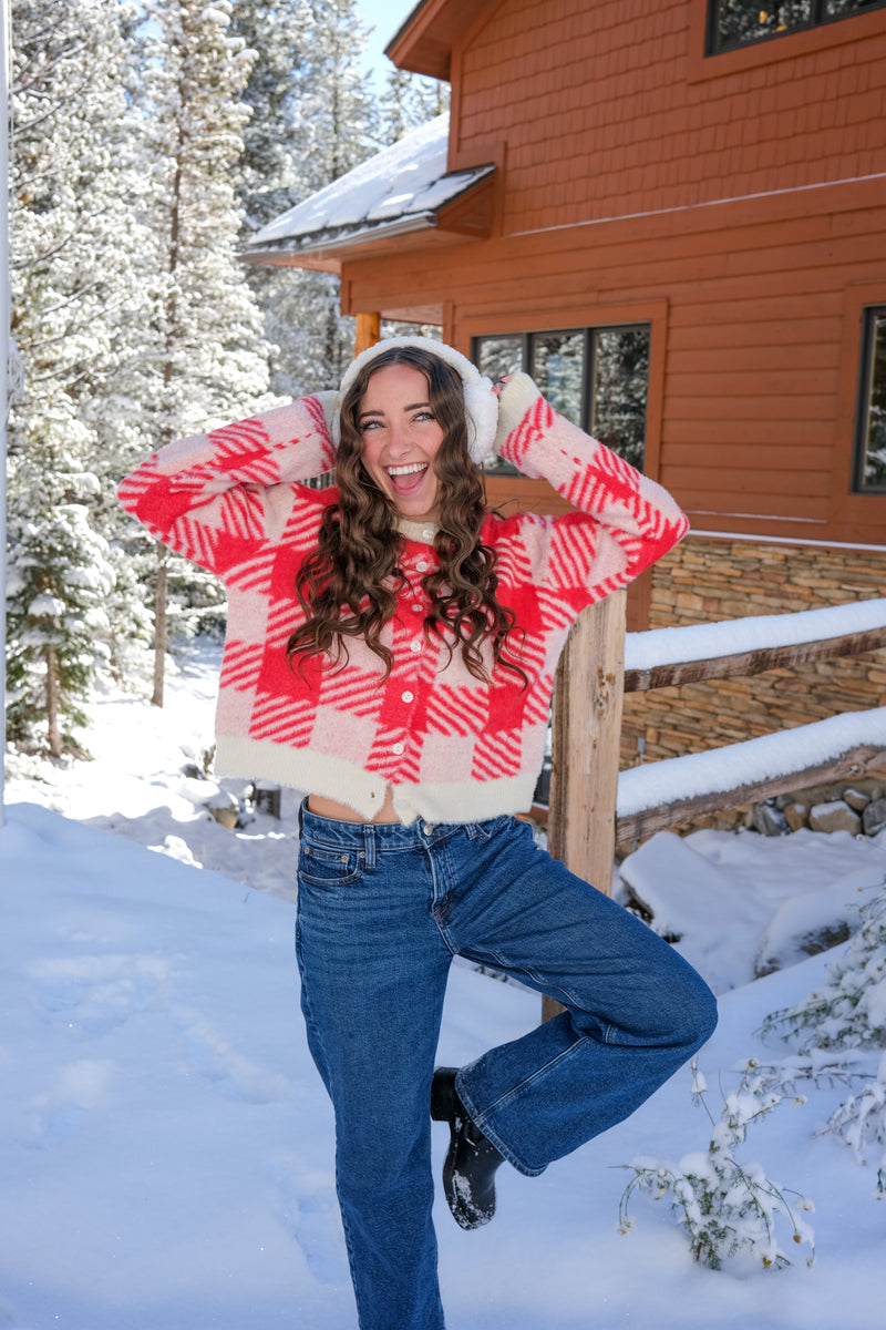 Woman wearing a red and white checkered sweater