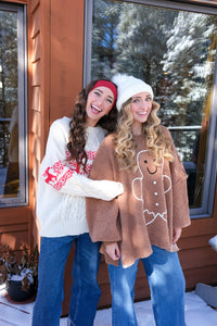 girls wearing holiday sweaters