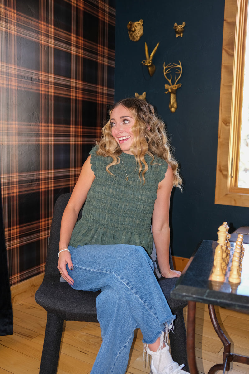 Woman wearing a green top 