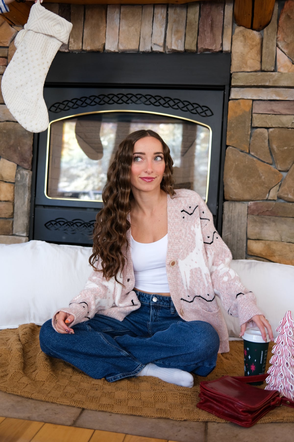 girl wearing pink holiday cardigan