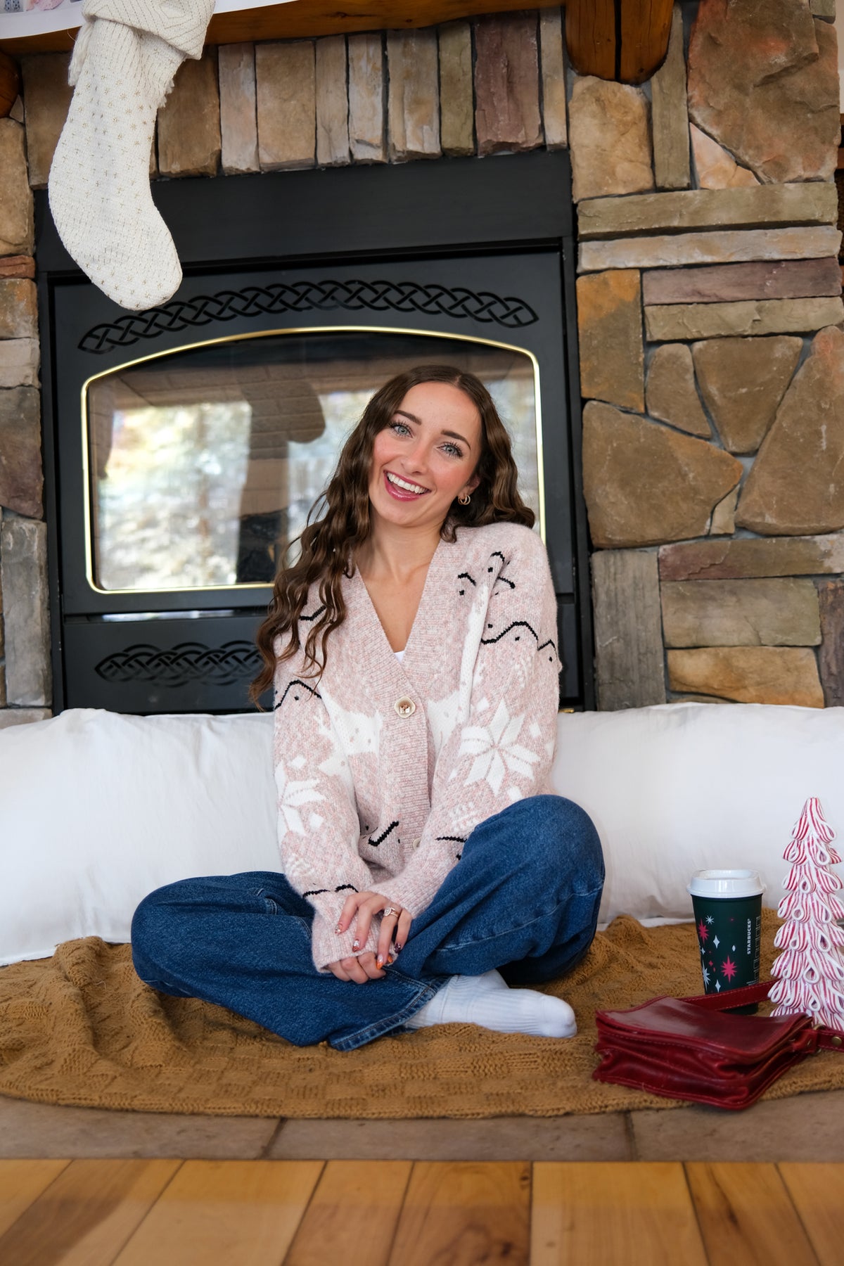 girl wearing pink holiday cardigan
