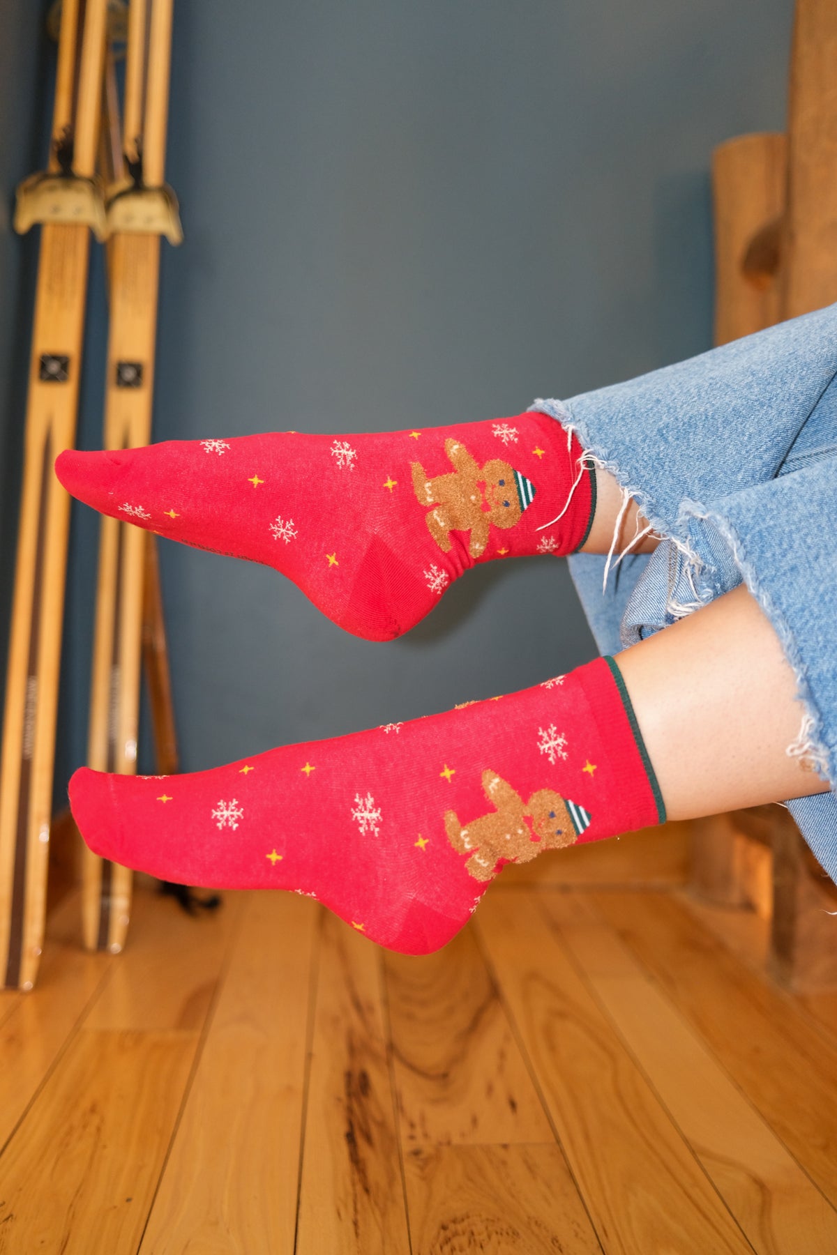 girl wearing red holiday socks