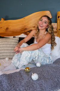 girl wearing holiday pajama pants