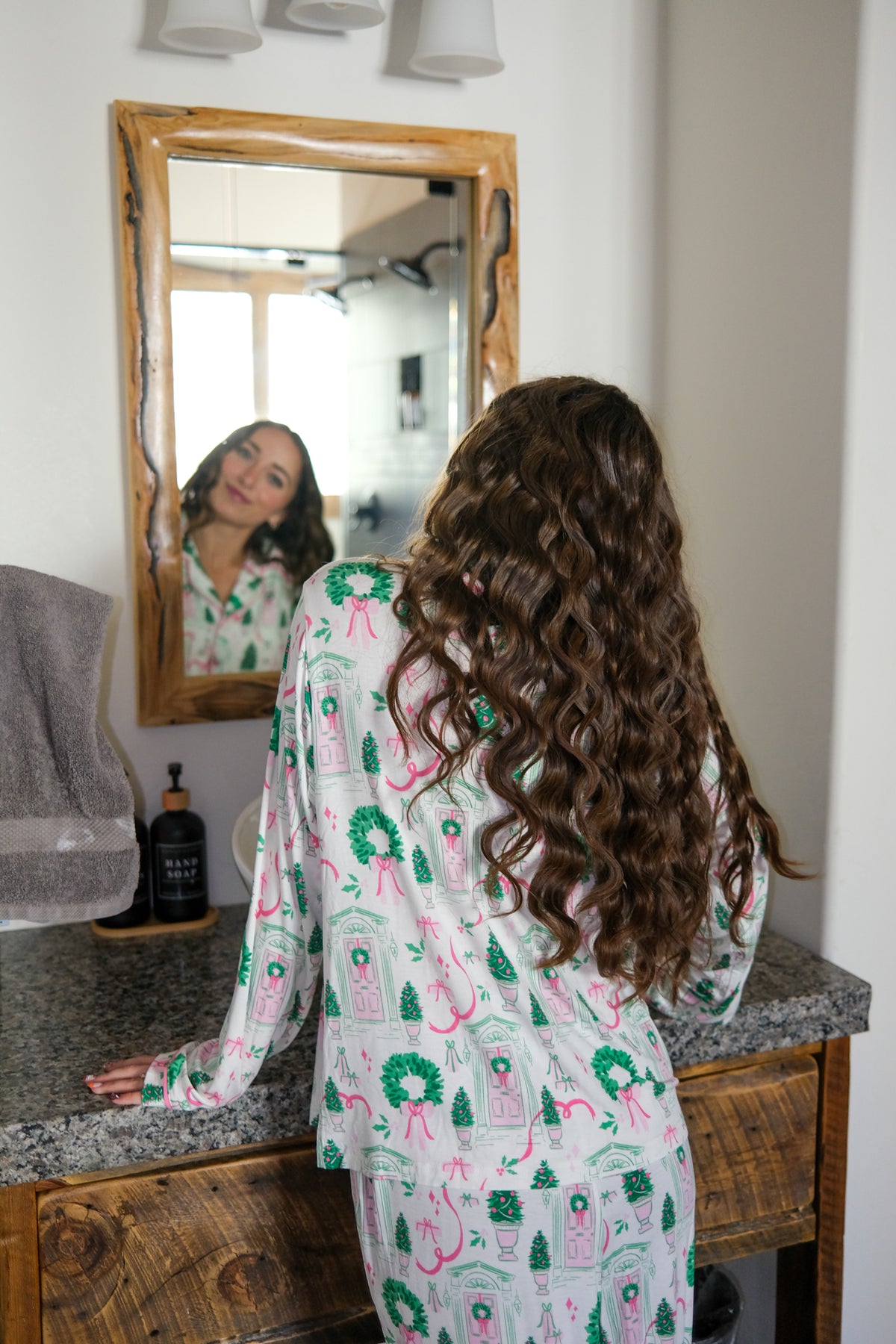 girl wearing white holiday pajamas
