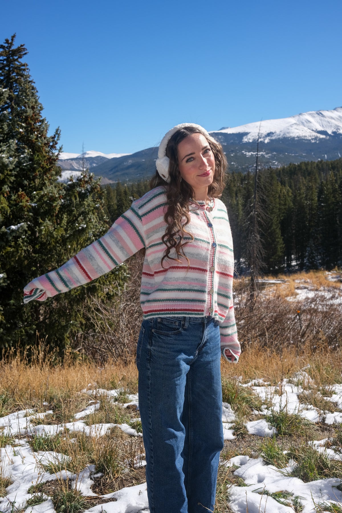 girl wearing pastel striped cardigan