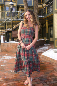 girl wearing plaid holiday dress