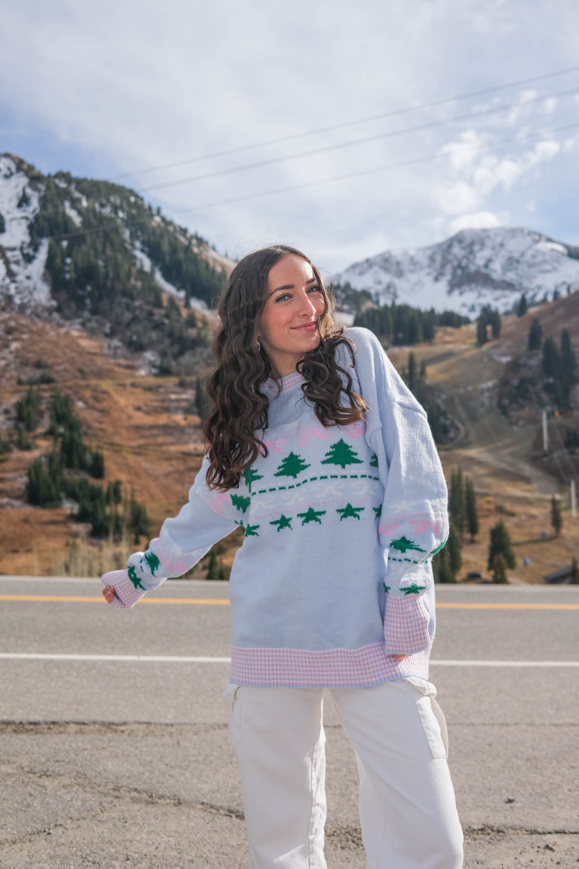 girl wearing light blue holiday sweater