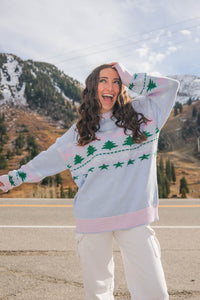 girl wearing light blue holiday sweater