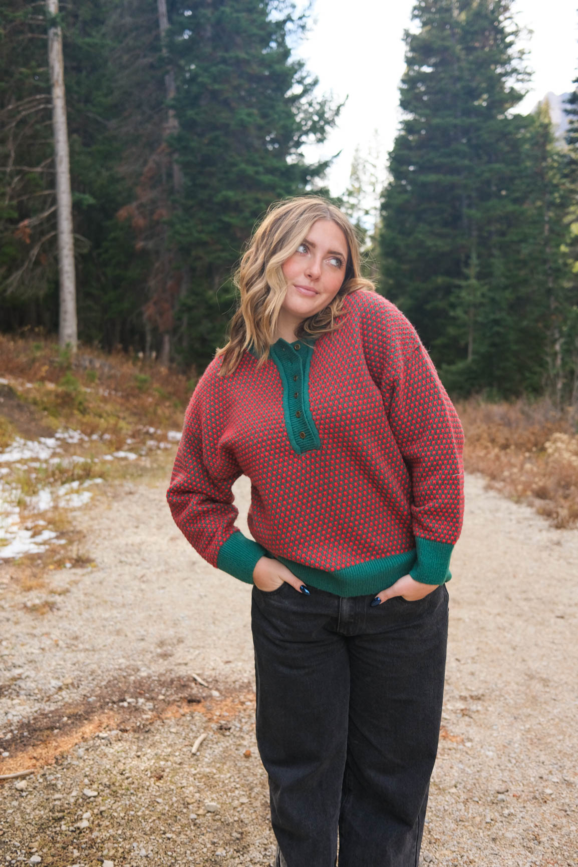 girl wearing red and green button down knit sweater