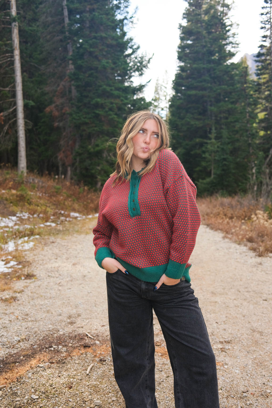 girl wearing red and green button down knit sweater