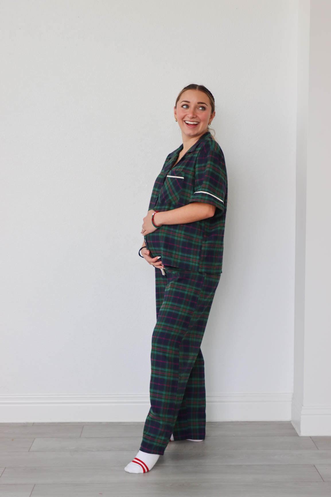 girl wearing dark green plaid pajamas