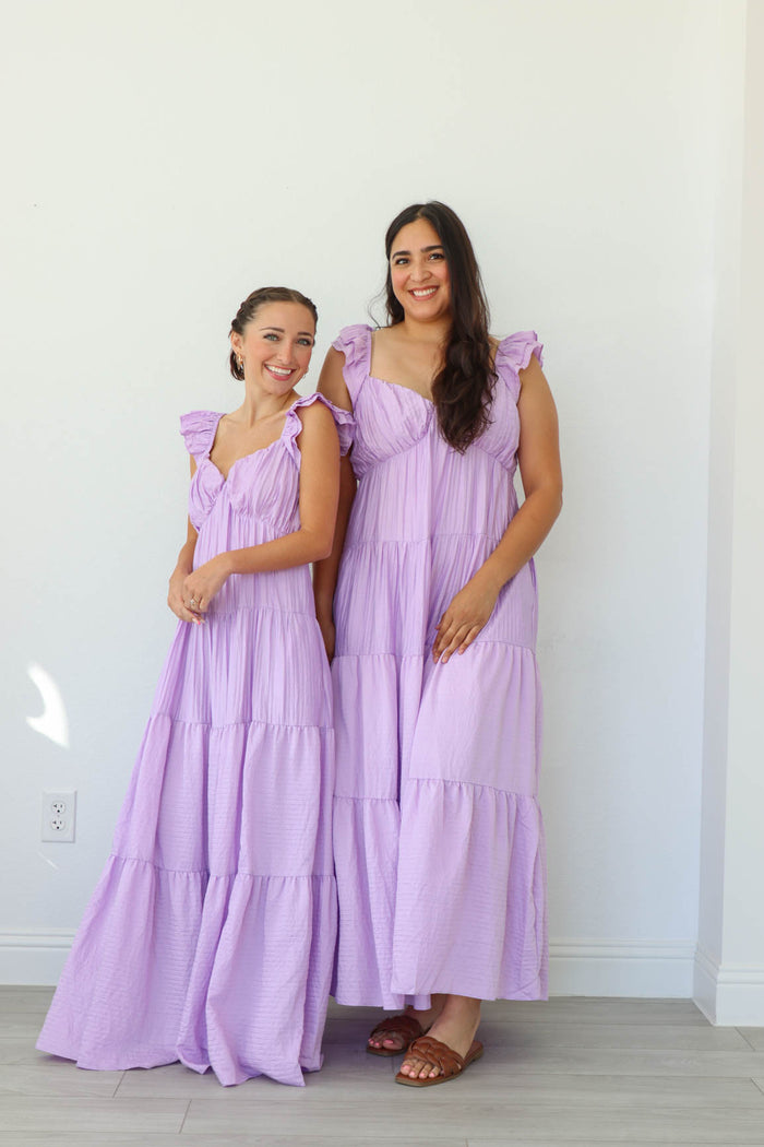 two girls wearing the same purple maxi dress