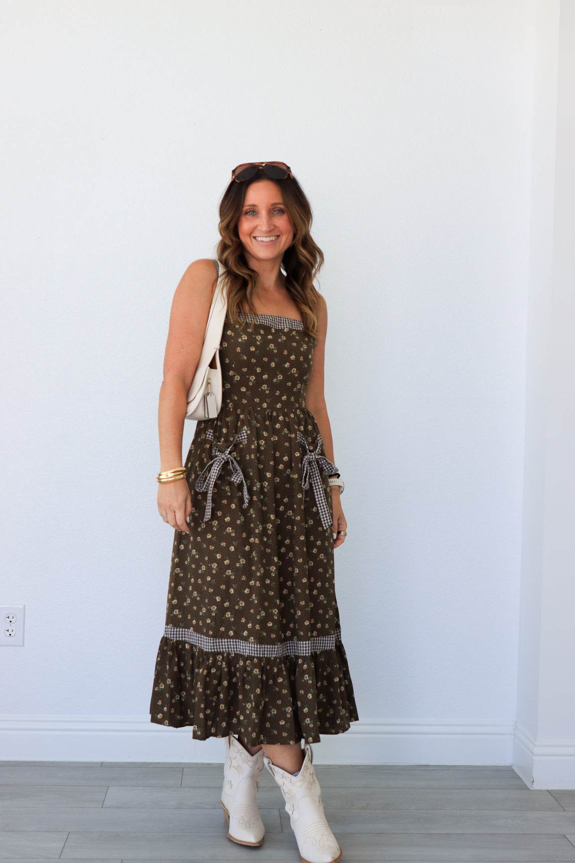 woman wearing brown floral maxi dress
