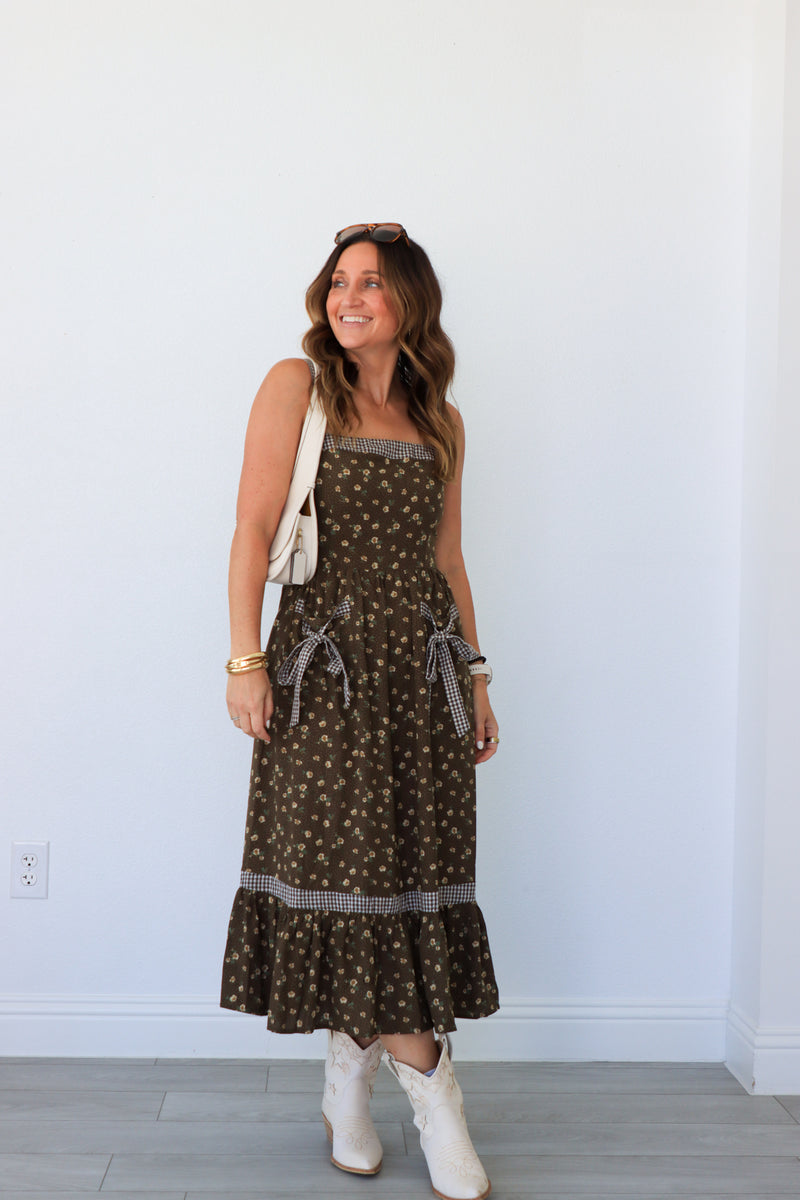 woman wearing brown floral maxi dress