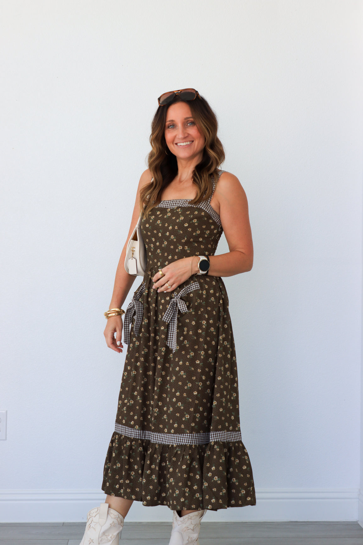 woman wearing brown floral maxi dress