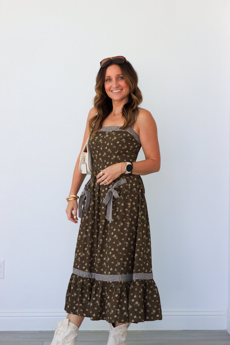 woman wearing brown floral maxi dress
