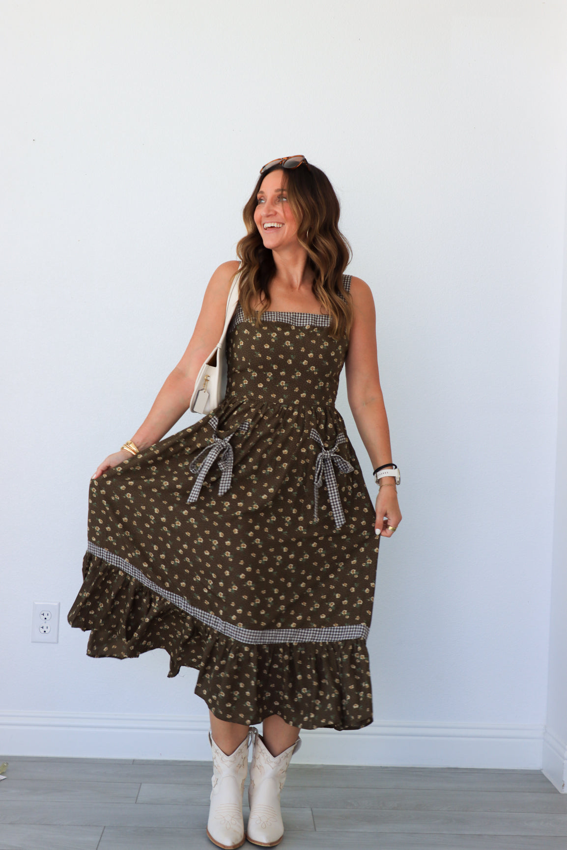 woman wearing brown floral maxi dress