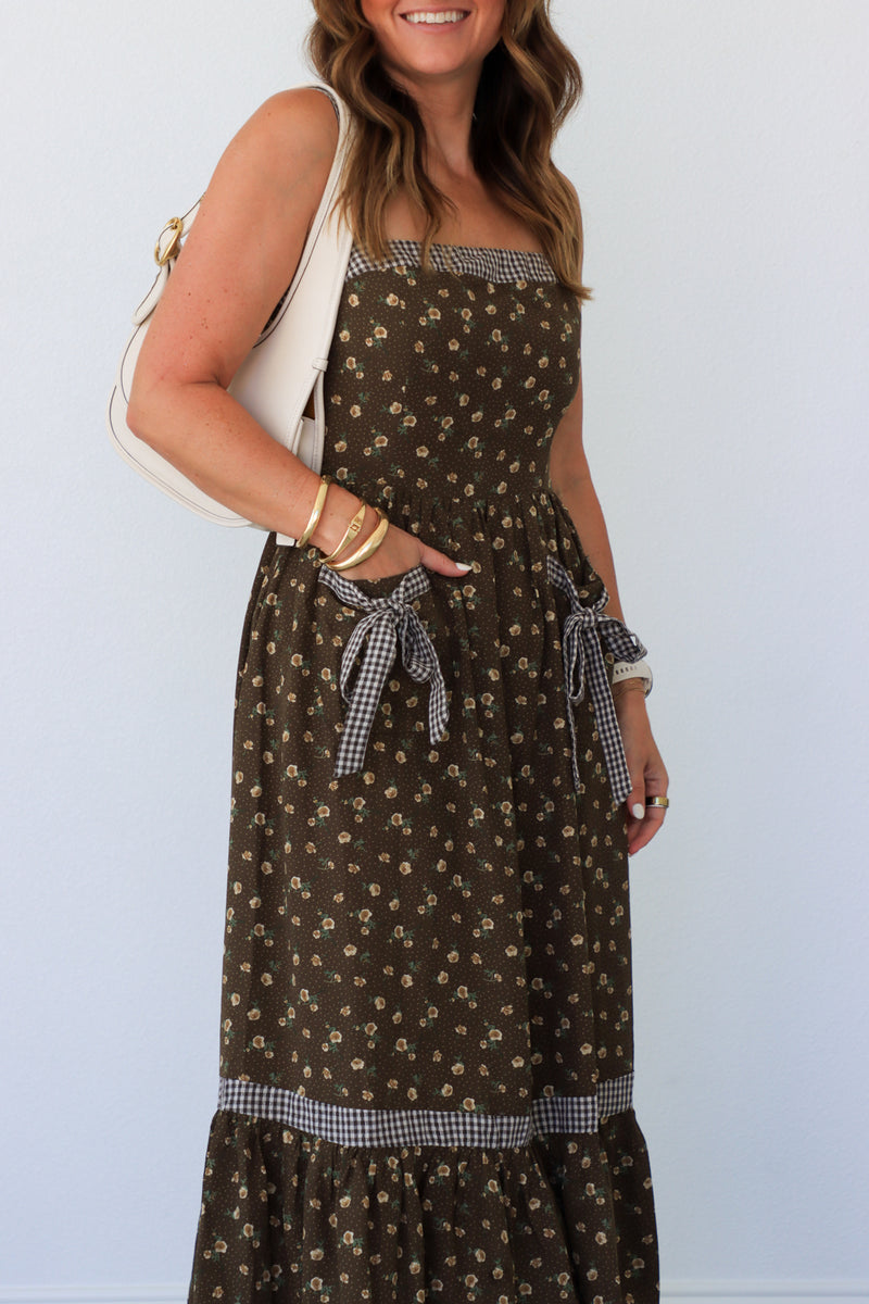 woman wearing brown floral maxi dress