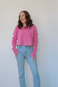 girl wearing berry pink waffle knit long sleeve top