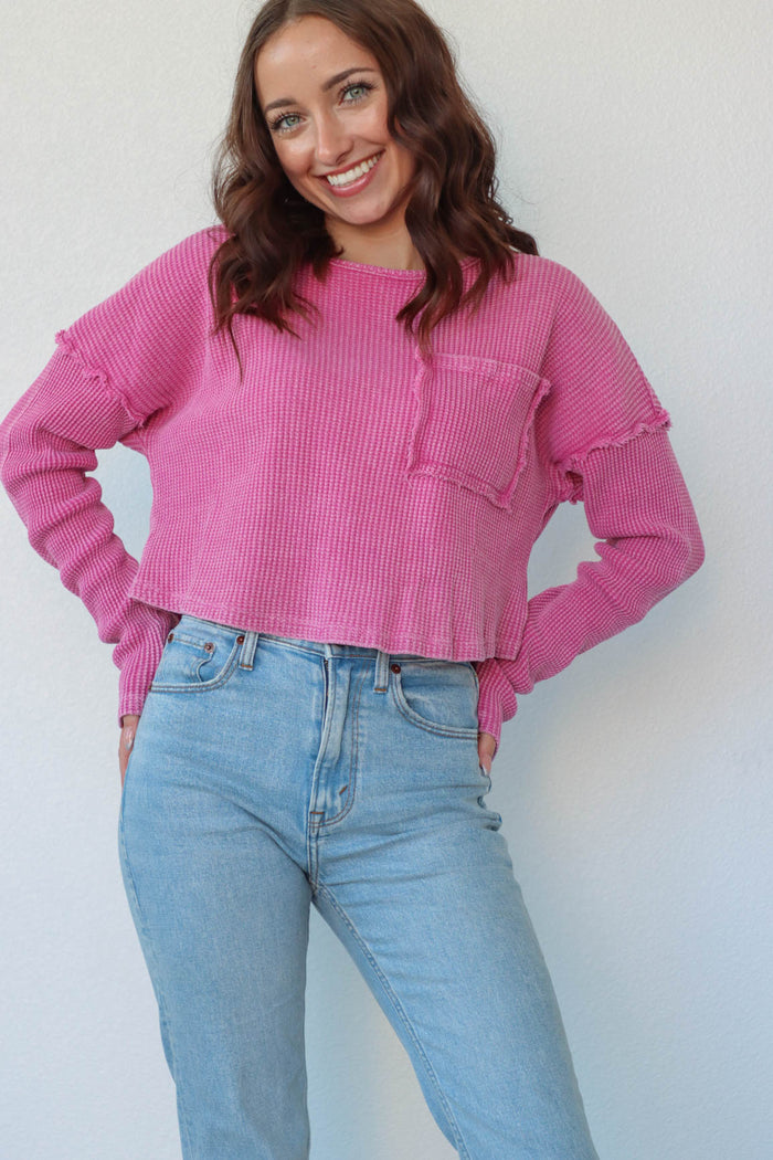 girl wearing berry pink waffle knit long sleeve top