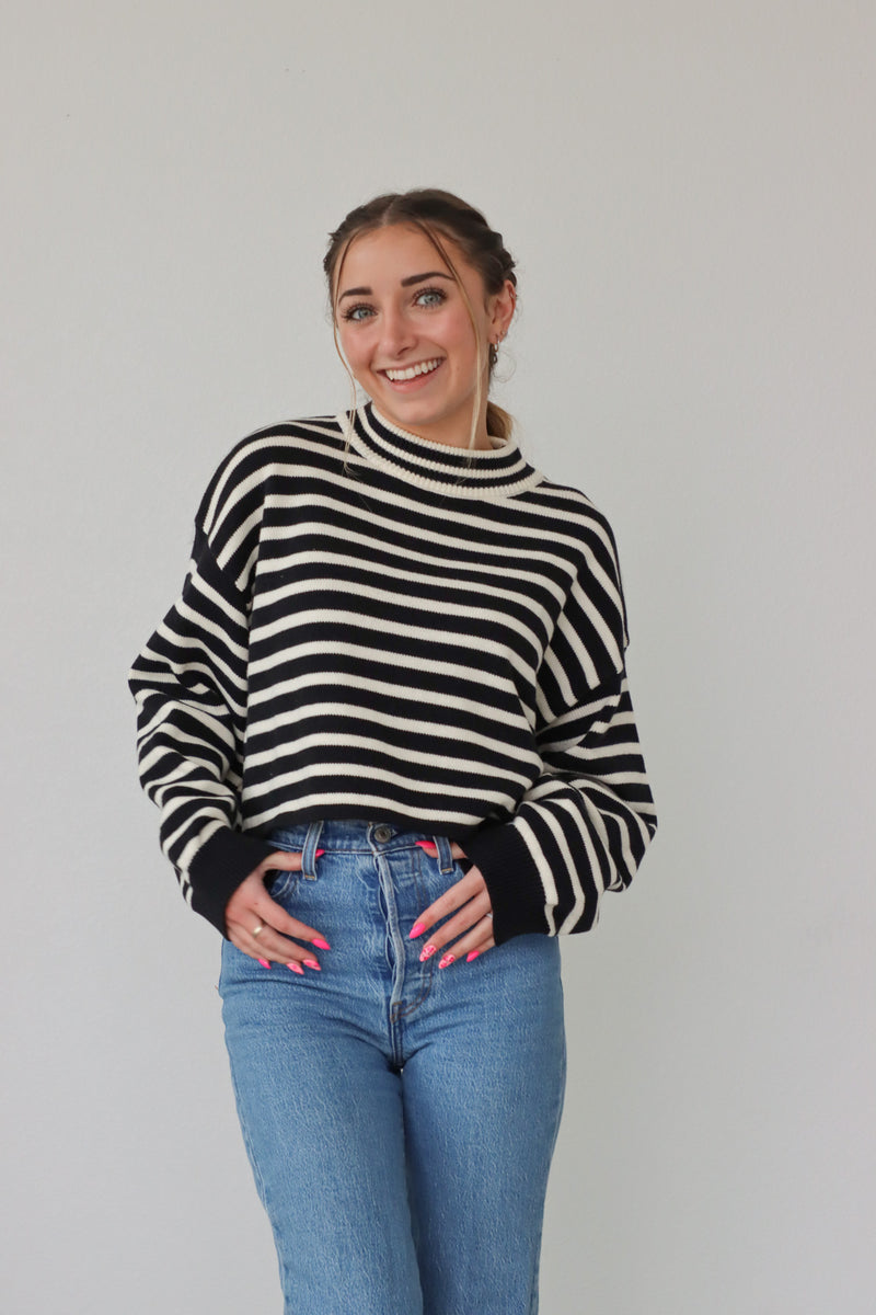 girl wearing black and white striped sweater