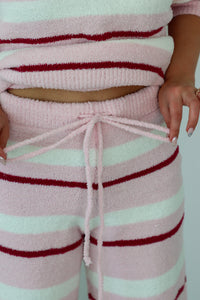 Pink and red striped set with a white background