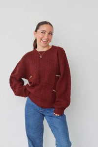 girl wearing dark red knit sweater