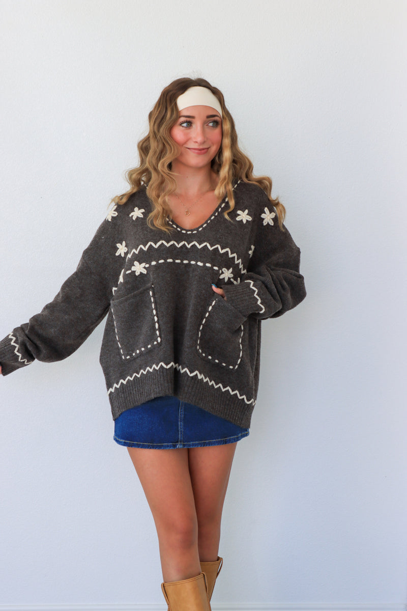 woman wearing dark gray sweater 