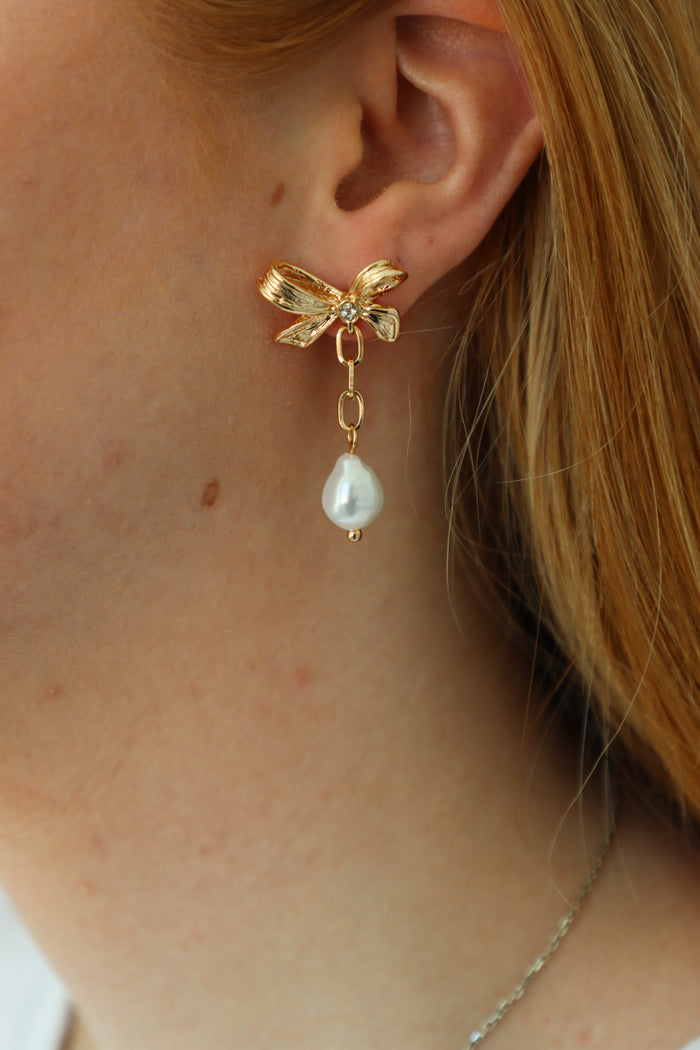 gold bow earrings with pearl detailing