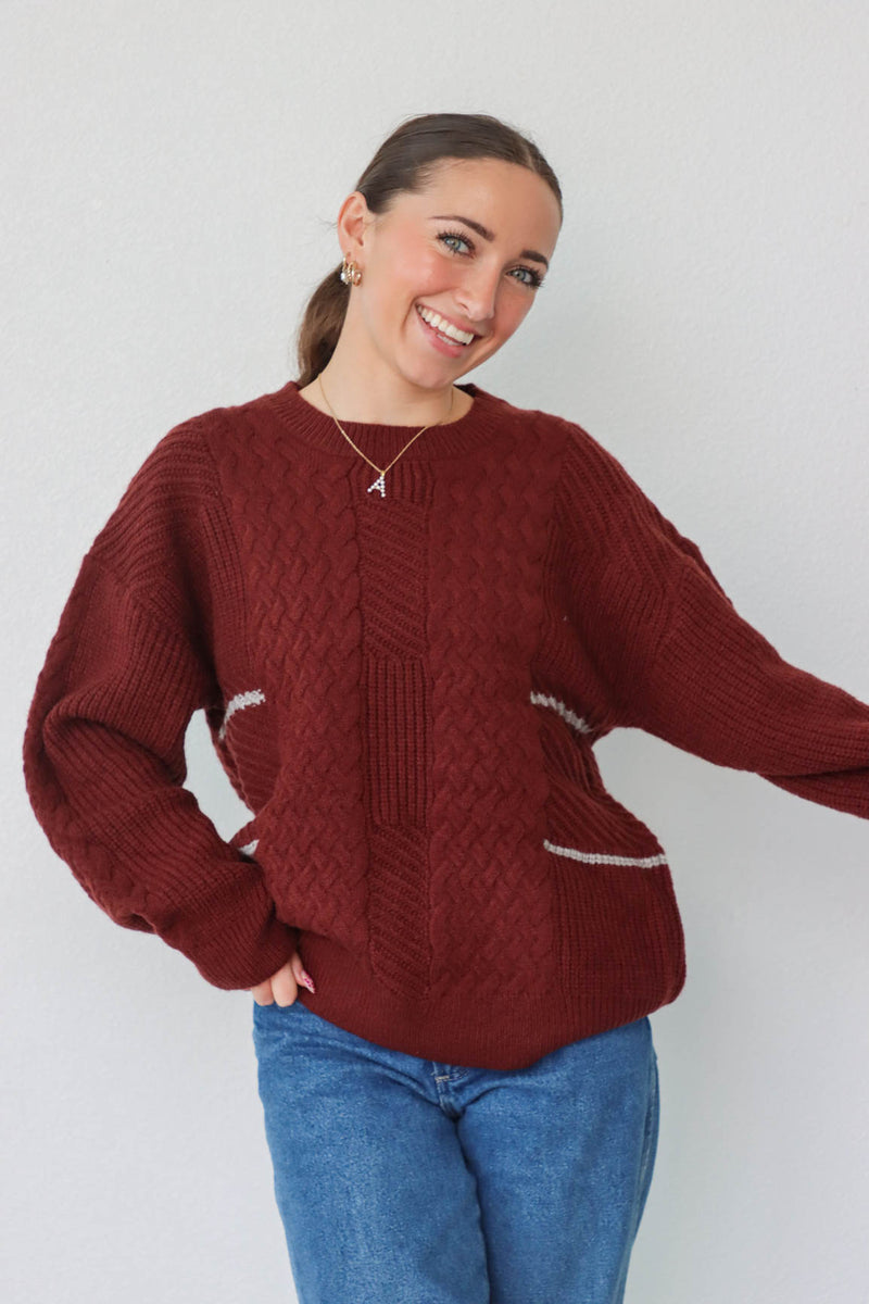 girl wearing dark red knit sweater