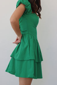 girl wearing emerald green short dress