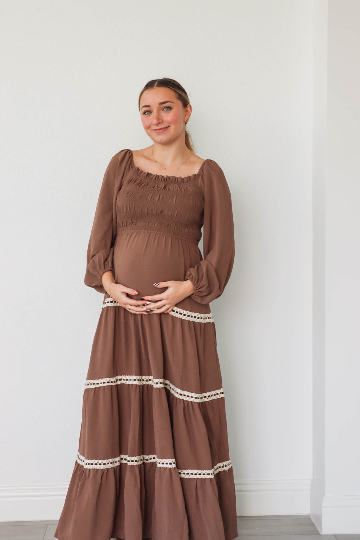 girl wearing long brown dress