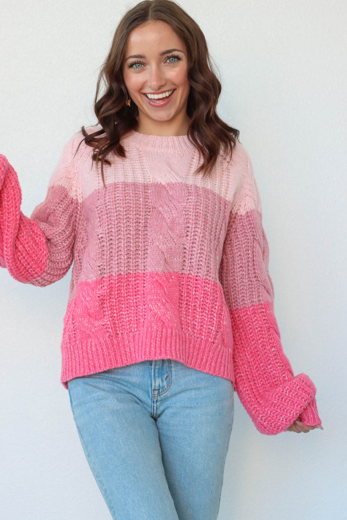 girl wearing multitoned pink cable knit sweater