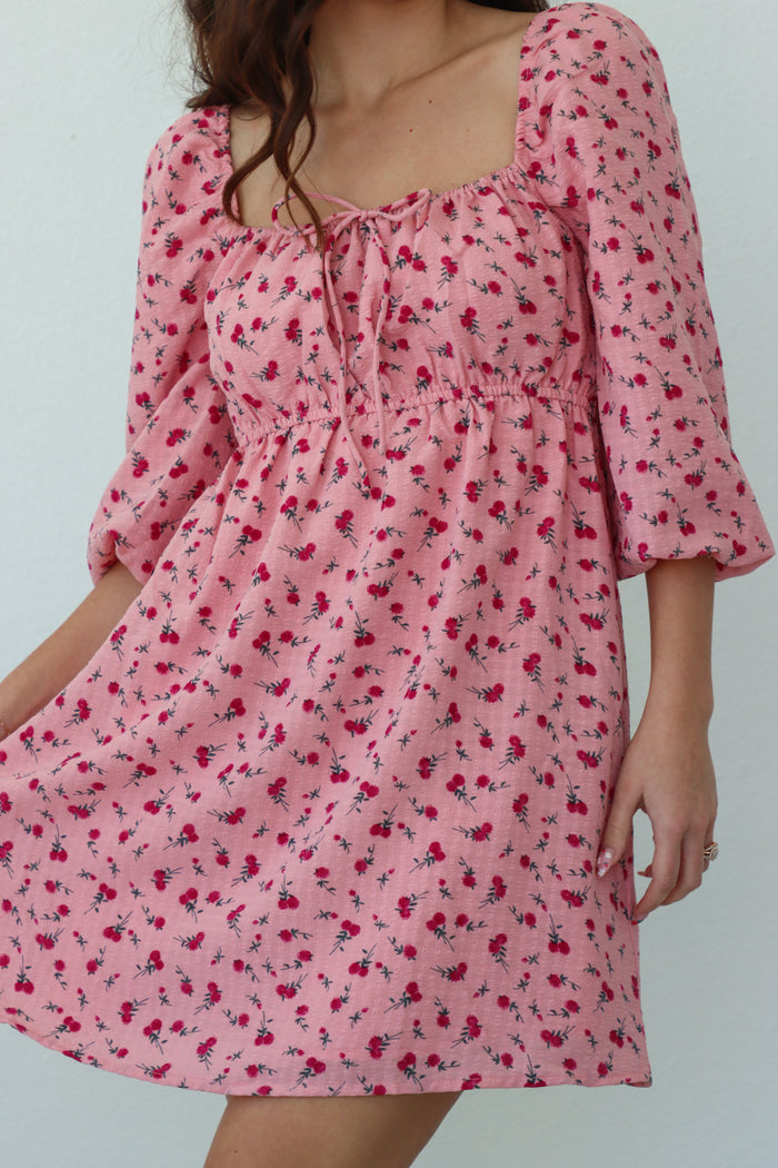 girl wearing pink floral dress