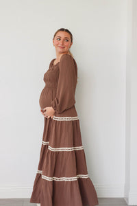 girl wearing long brown dress