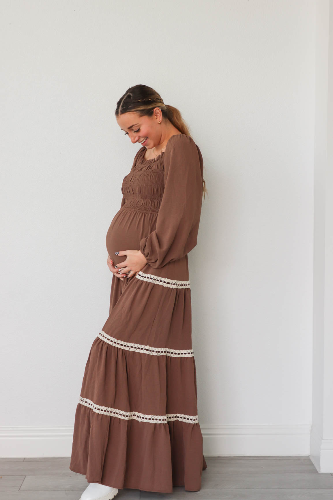 girl wearing long brown dress