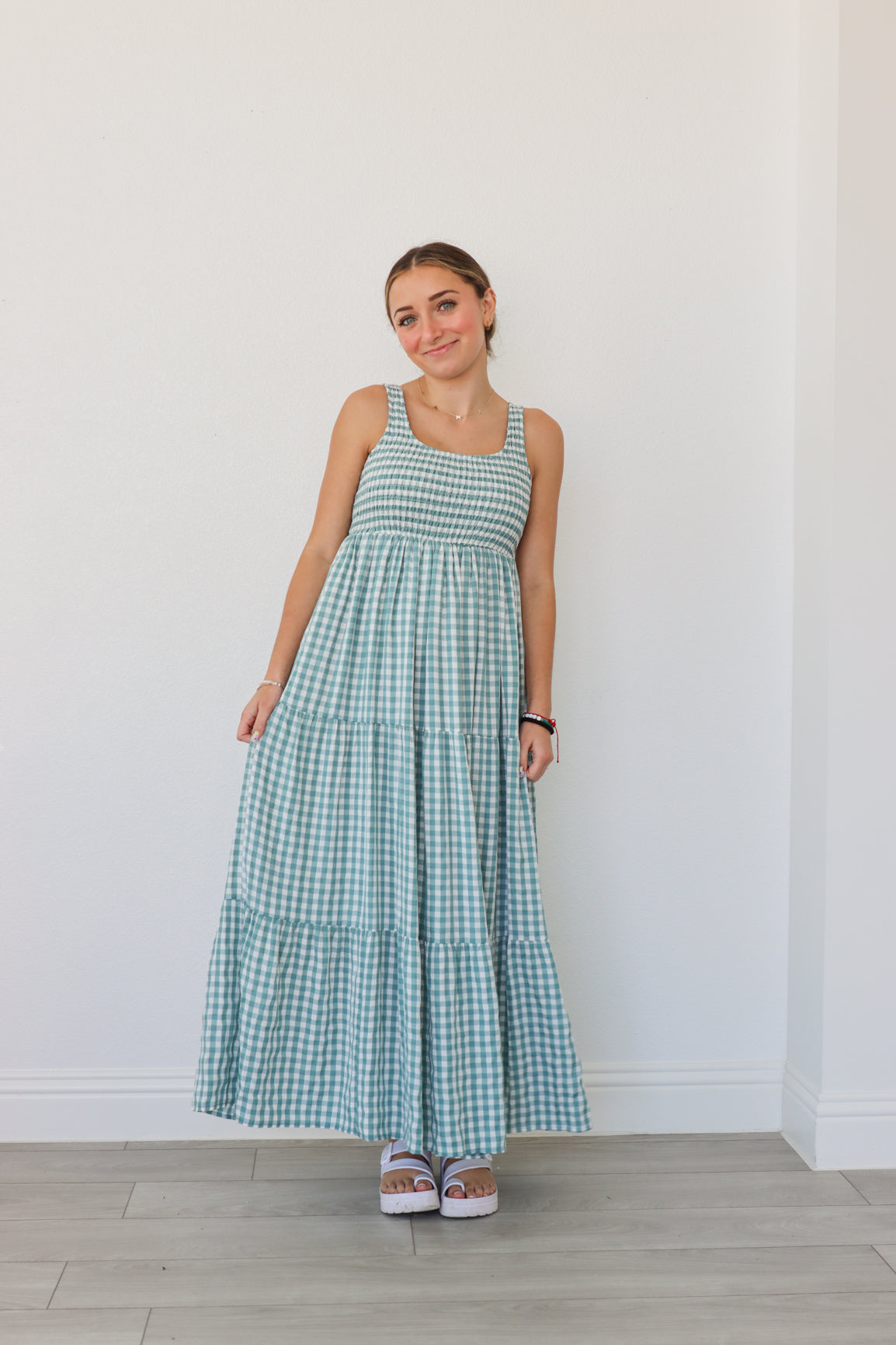 girl wearing blue gingham maxi dress