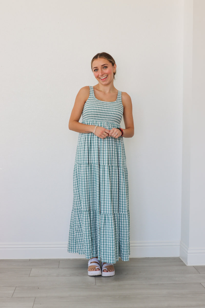 girl wearing blue gingham maxi dress