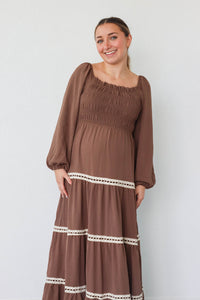 girl wearing long brown dress